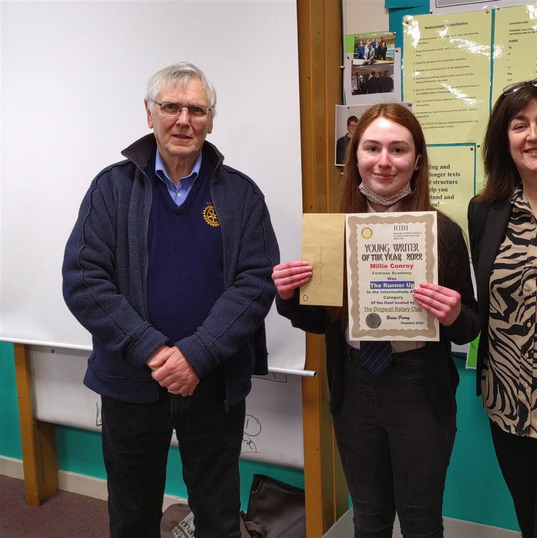 Millie Conroy with Brian Parry from Dingwall Rotary Club and acting head, Jacquie Ross.