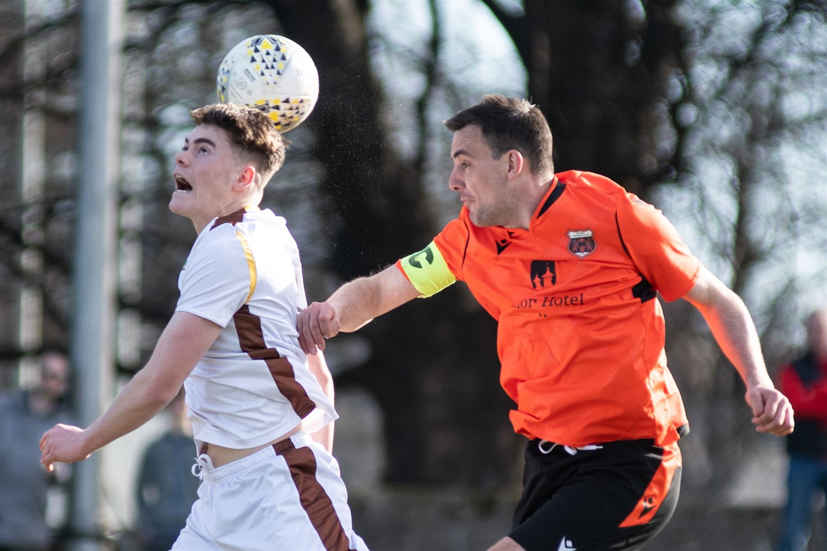 Forres Mechanics' Jack Craib wins this header ahead of Rothes skipper Bruce Milne in a Highland League clash in 2022. Picture: Daniel Forsyth.