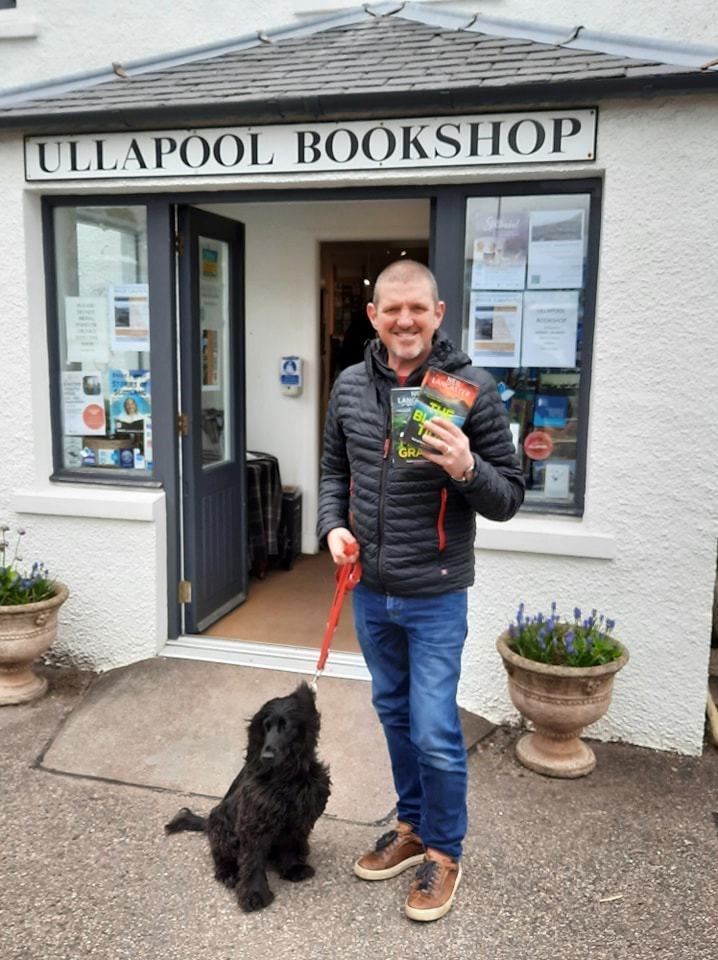 Neil Lancaster dropped into Ullapool bookshop with his black spaniel Peggy, on 2 April 2024.