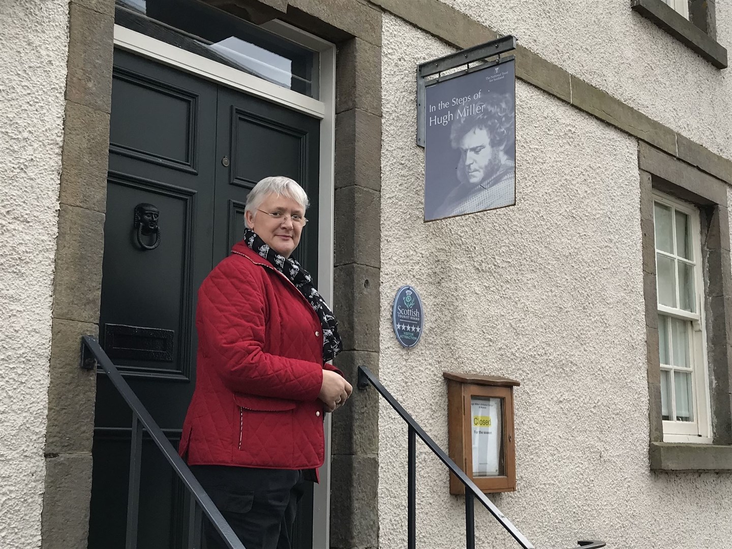 Dr Alix Powers-Jones outside the entrance to Hugh Miller's Birthplace Cottage and Museum.