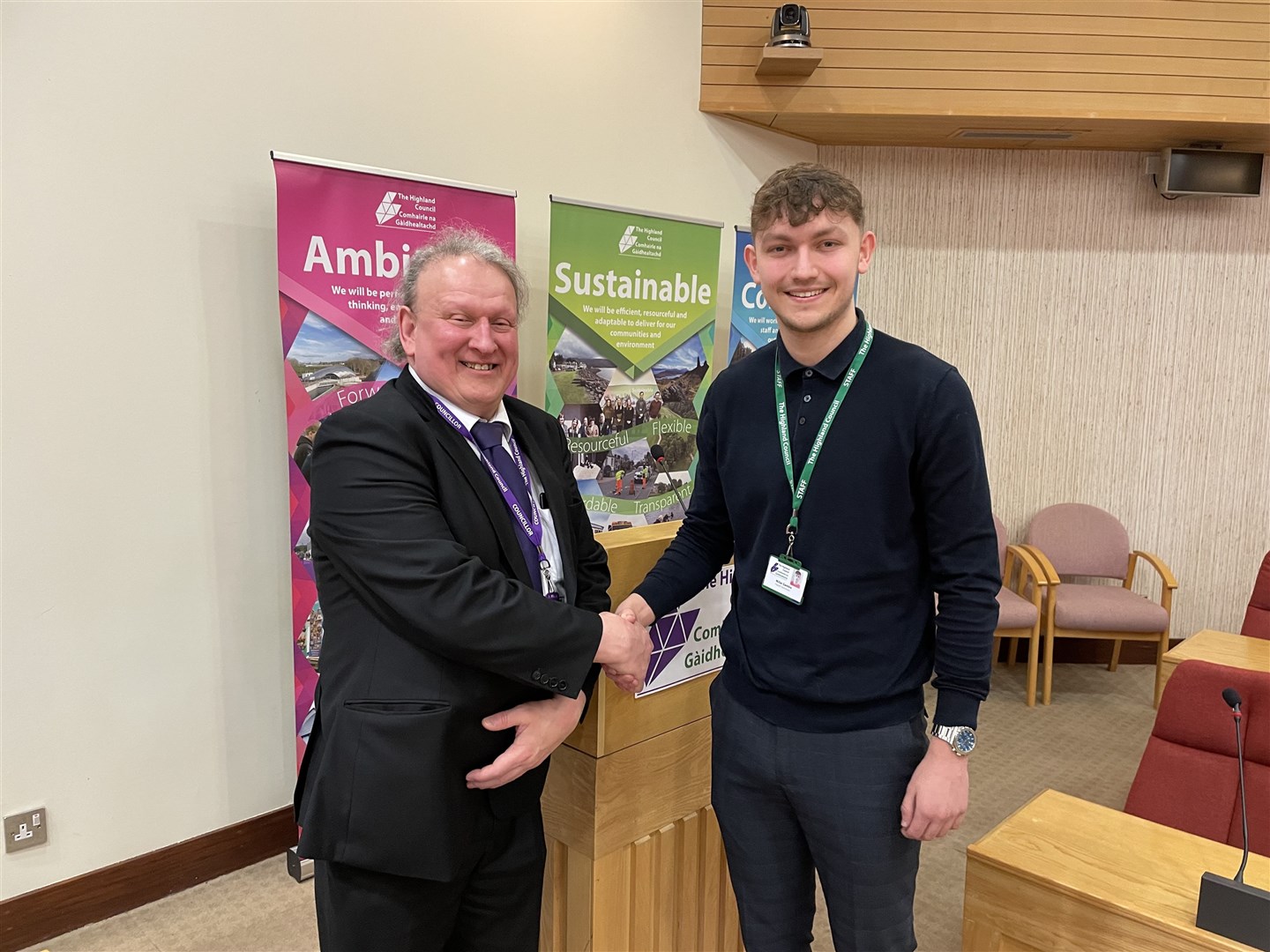Millar is congratulated by the chairman of the Corporate Resources Committee, Cllr Derek Louden, who is a Tain and Easter Ross councillor.