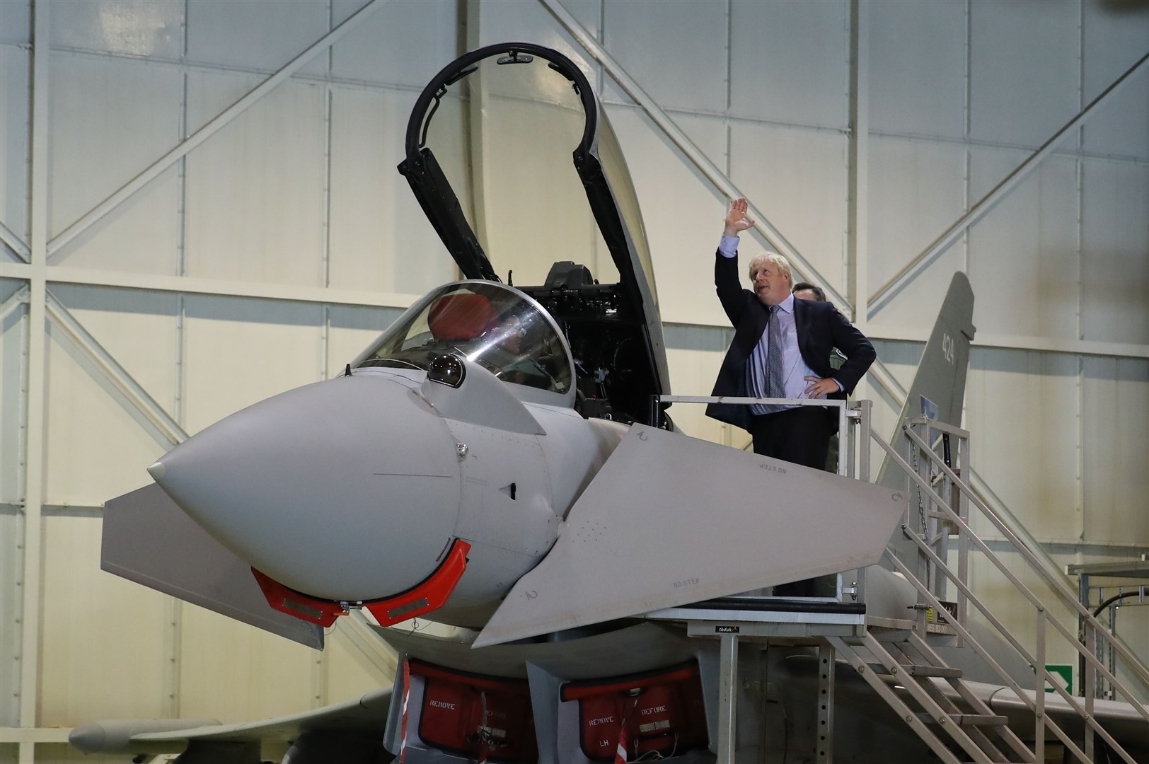 Boris Johnson looks at a Typhoon fighter jet (Andrew Milligan/PA)