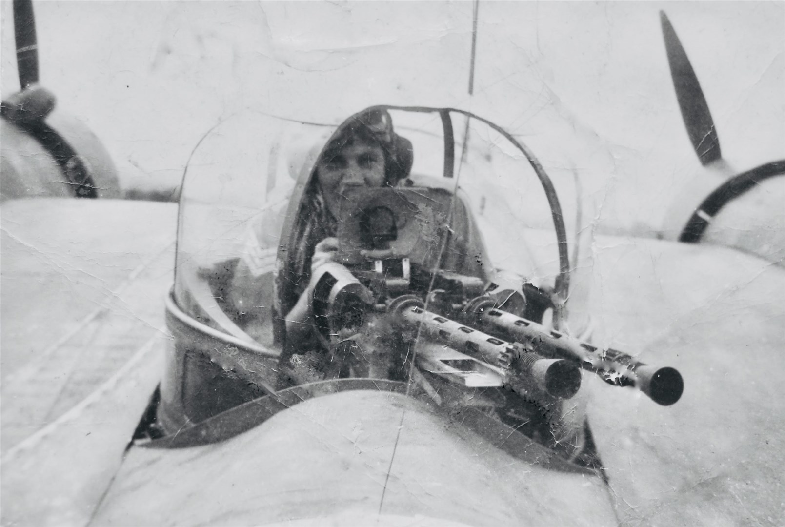 Flt Sgt Ron Chapman in a Bisley gun turret, which added weight to the aircraft without additional engine power. The location is likely Djinna Island off Saudi Arabia, April, 1943. The team repairing and rescuing the aircraft flew out of Bahrein.