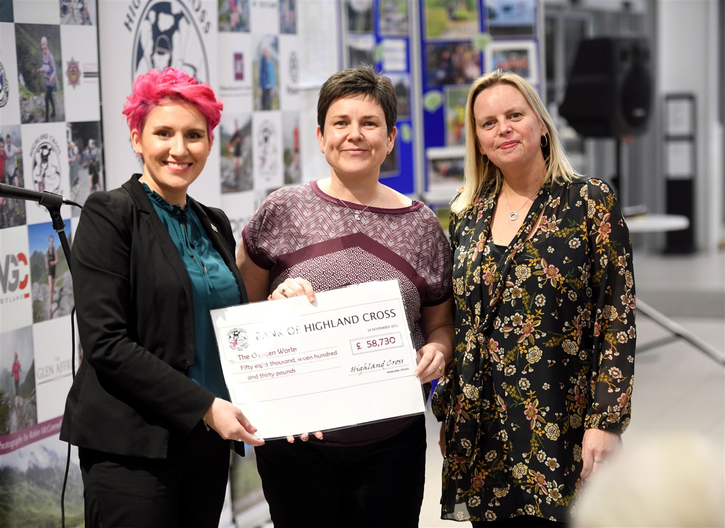The Oxygen Works chief executive Leigh-ann Little (left) and operations manager Jenni Donnelly (right) accept a cheque from Fiona Kennedy. Picture: James Mackenzie
