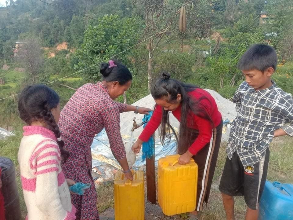Villagers using the new taps.