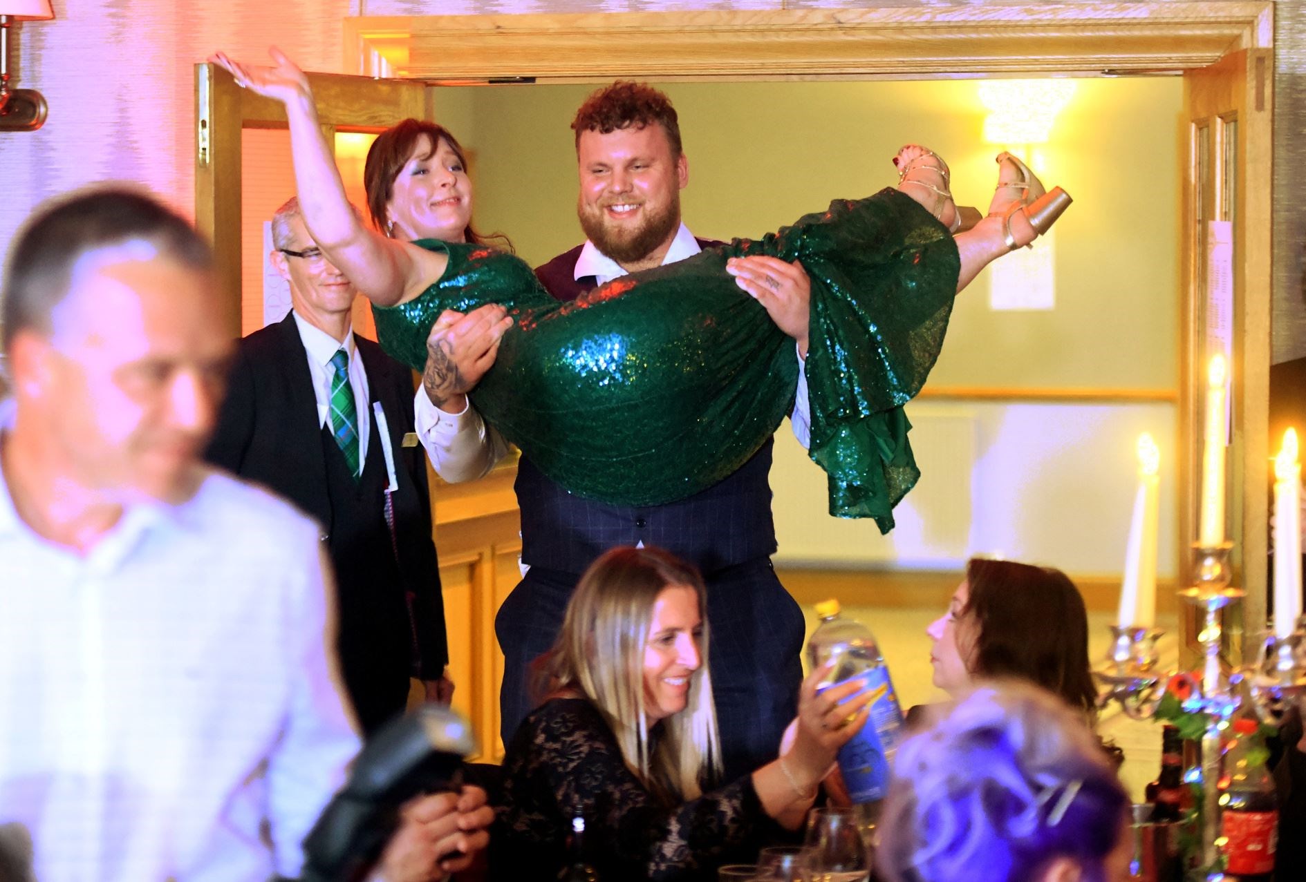 Tom Stoltman carrying Nicola McAlley in to the room. Picture: James Mackenzie