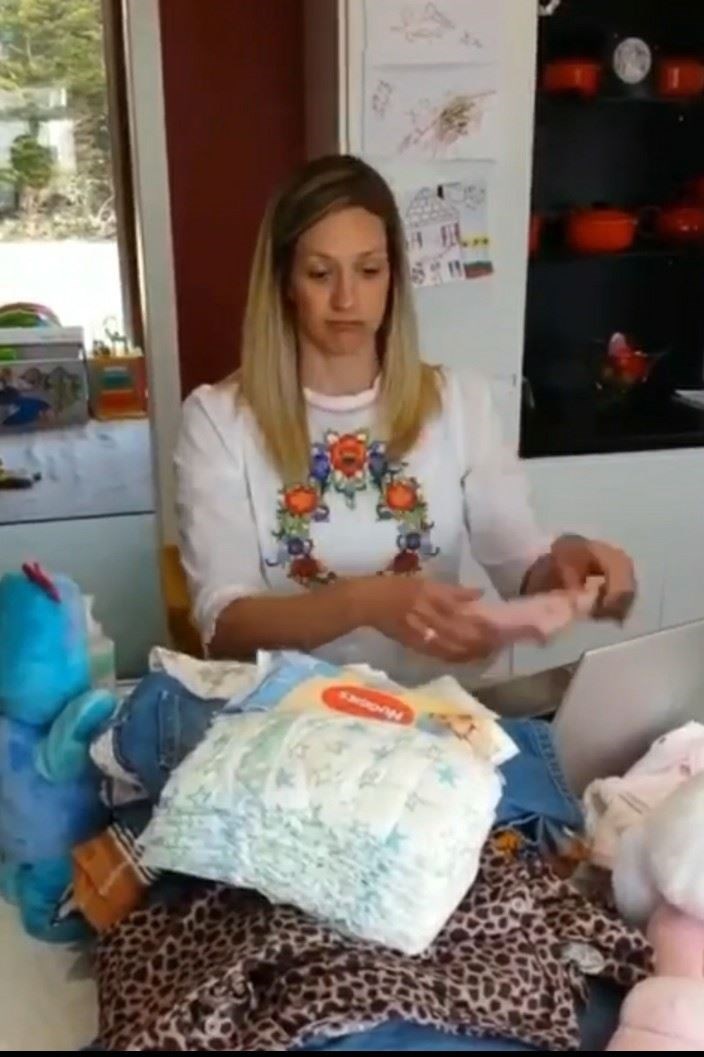 The video starts with a teacher sorting out her daily work surrounded by a pile of washing.