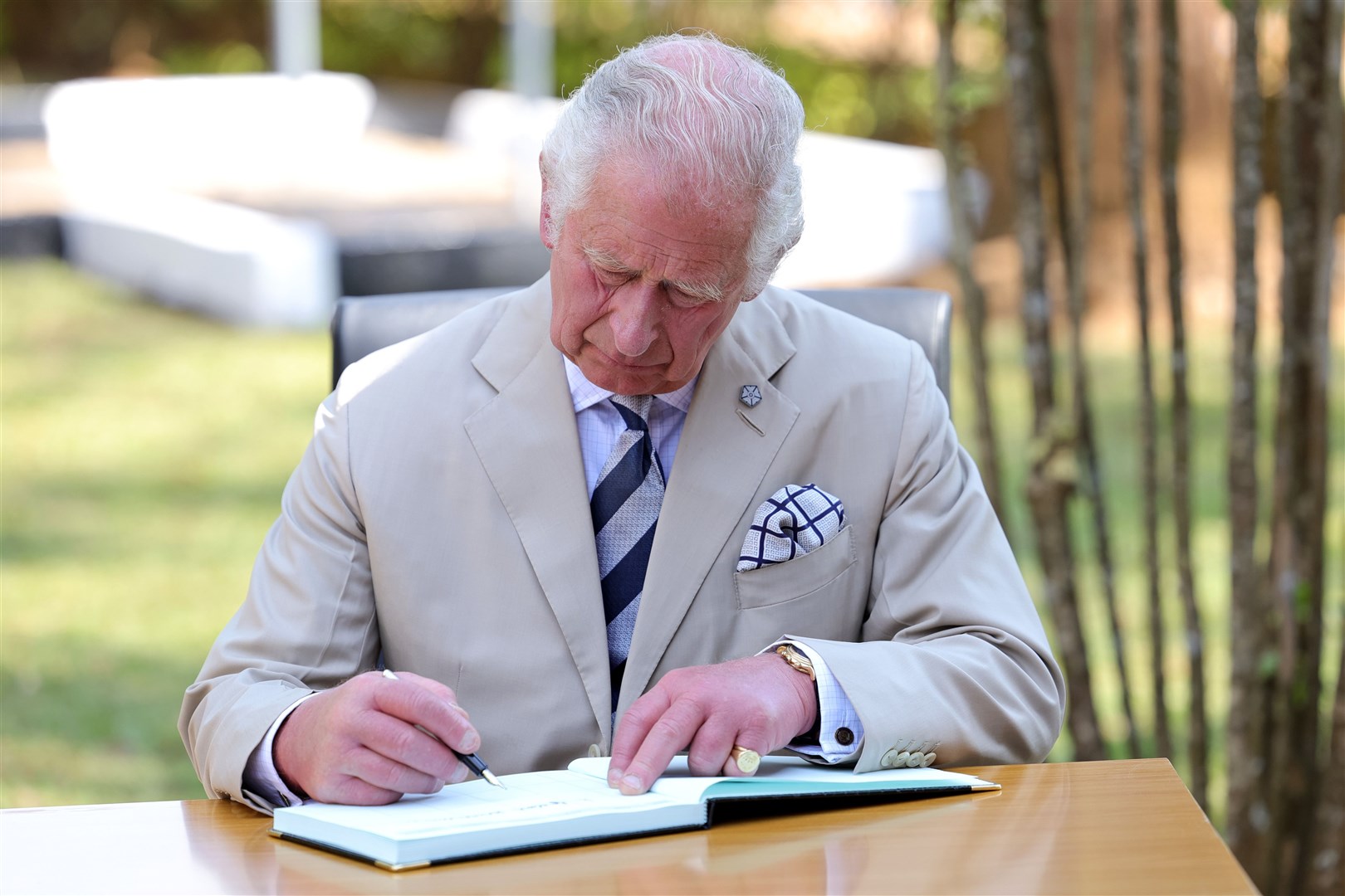 The Prince of Wales signs the visitors’ book during his visit to the Nyamata Church Genocide Memorial (Chris Jackson/PA)