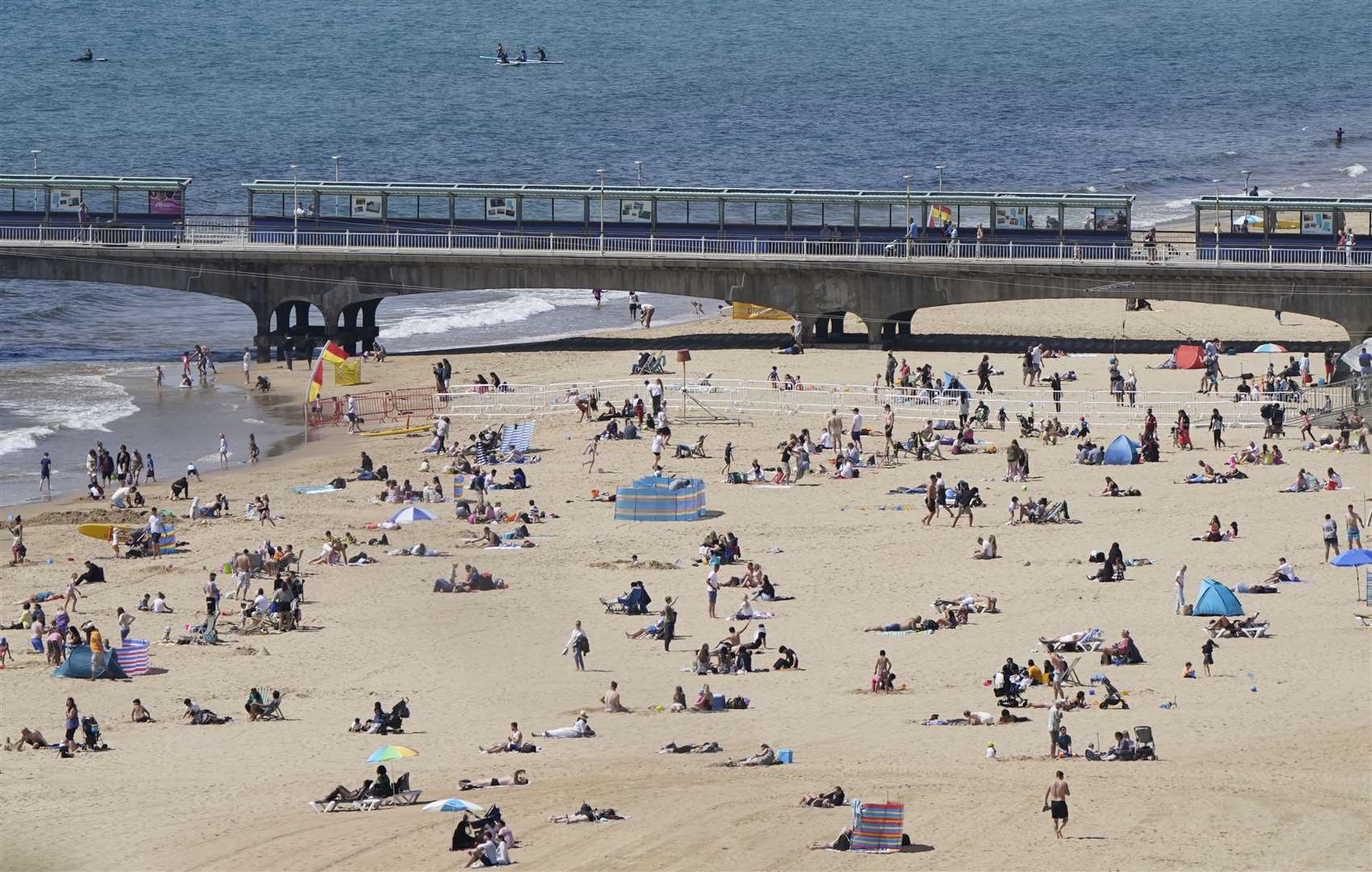In Bournemouth, Dorset, beach-goers were out early to make the most of the sunshine (Andrew Matthews/PA)