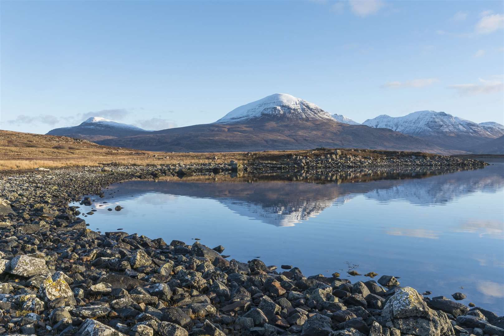 The Torridon landscape reflected in Upper Loch Torridon. Communities around Torridon and Applecross have been reporting irresponsible behaviour by some campers since lockdown restrictions eased.