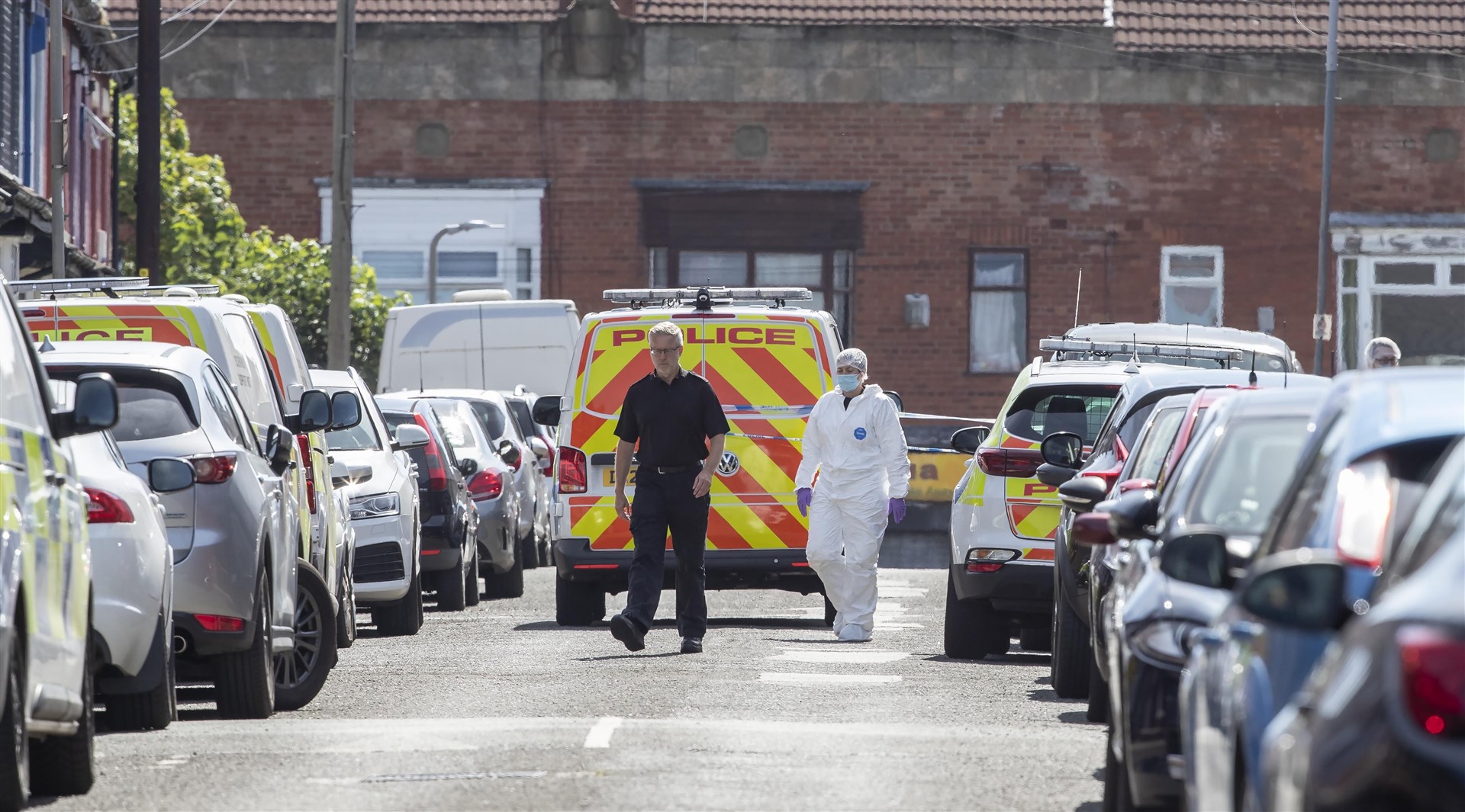 Police and forensic officers on Leinster Road in Old Swan, Liverpool (Jason Roberts/PA)