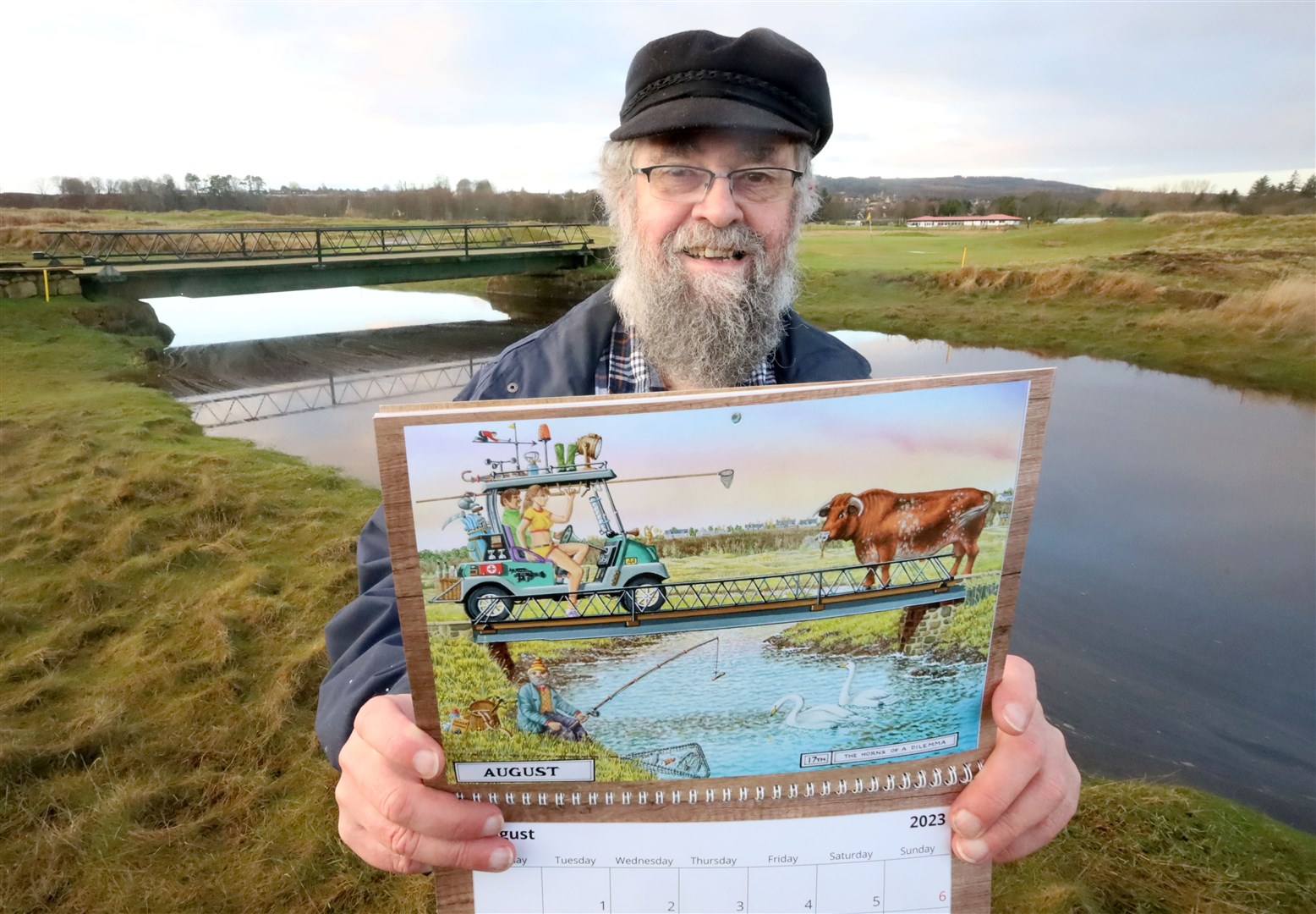 Mike Taylor holding the Tain Golf Club 2023 calendar that he illustrated. Picture: James Mackenzie.