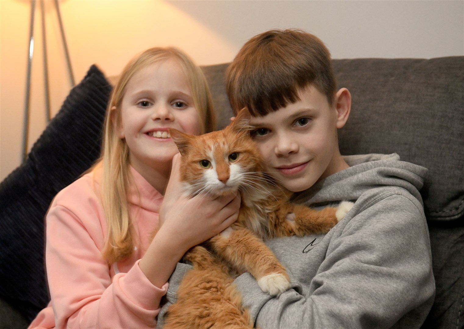 Ginger back where he belongs with Emma (9) and Ewan Low (13). Picture: James Mackenzie.