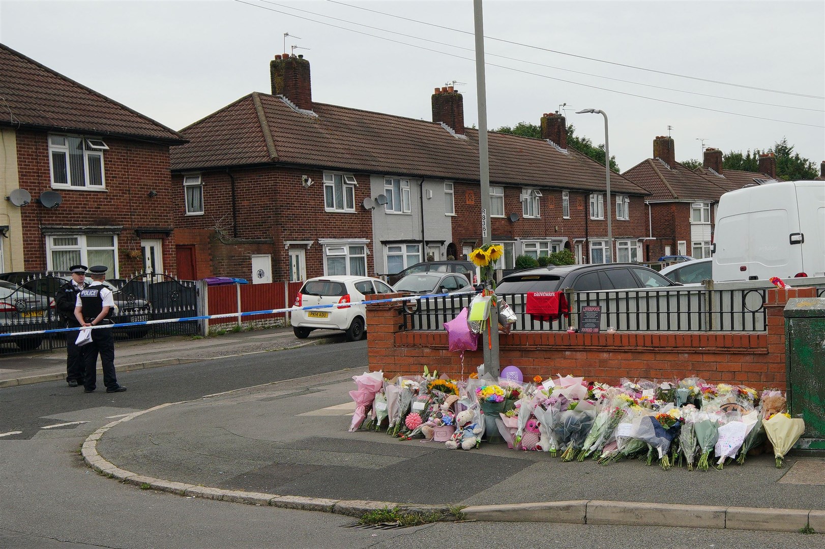 Flowers are left near to the scene of an incident in Kingsheath Avenue, Knotty Ash, Liverpool (Peter Byrne/PA)