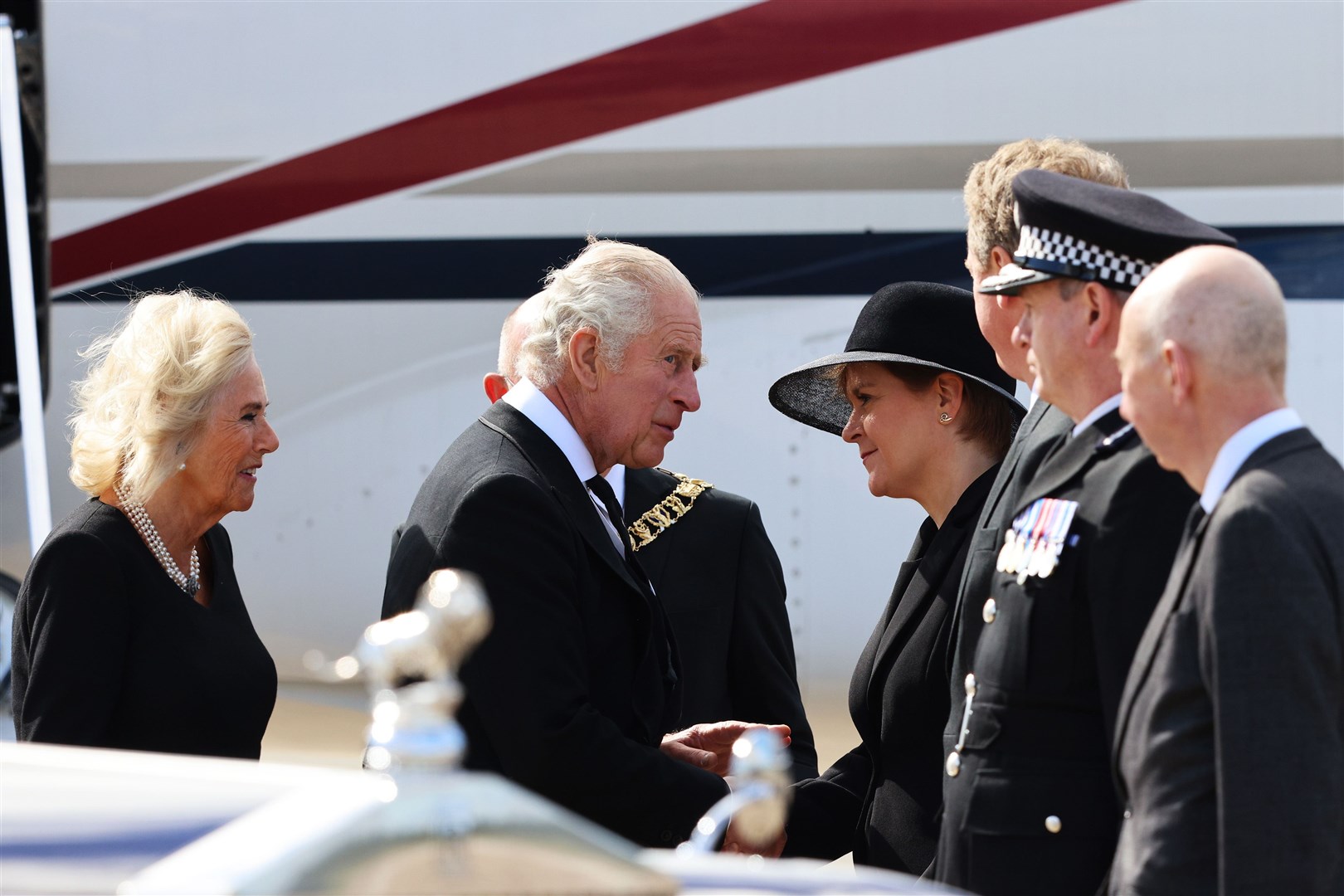 Meeting the King and Queen Consort as they arrive at Edinburgh Airport after travelling from London, ahead of joining the procession of the Queen’s coffin from the Palace of Holyroodhouse to St Giles’ Cathedral (Robert Perry/PA)