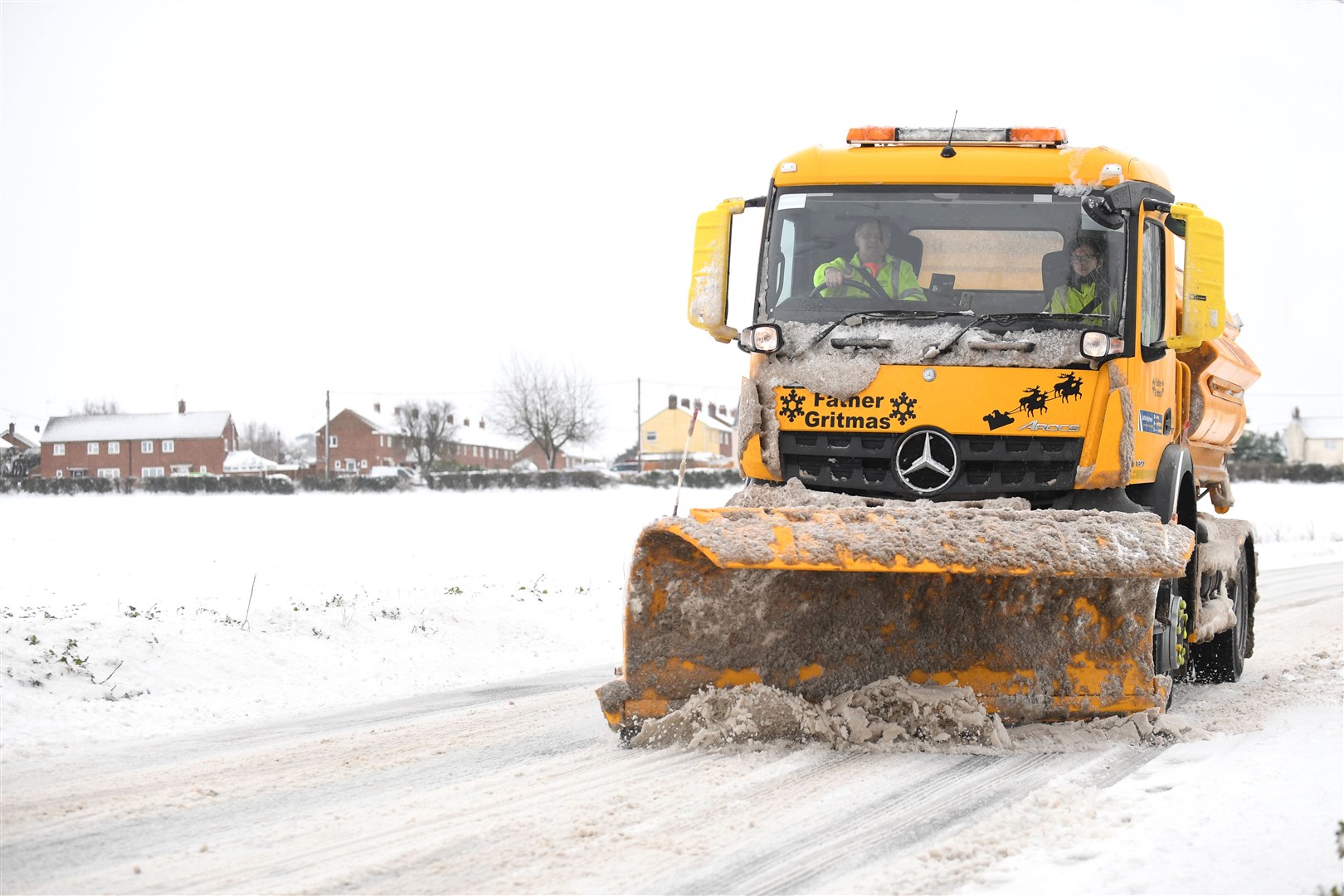 A ‘Father Gritmas’ snowplough clears the road through Barham, Suffolk (Joe Giddens/PA)