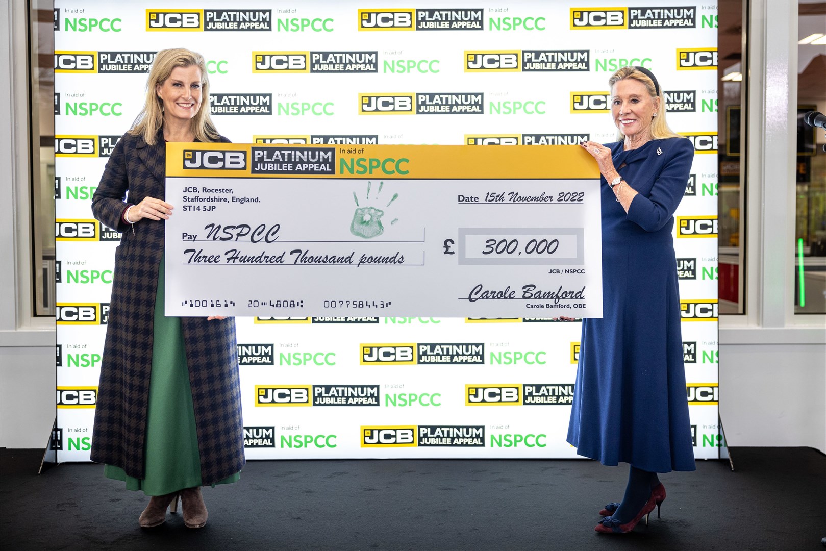 The Countess of Wessex (left) receives a £300,000 cheque for the children’s charity NSPCC from Carole Bamford (James Speakman/PA)