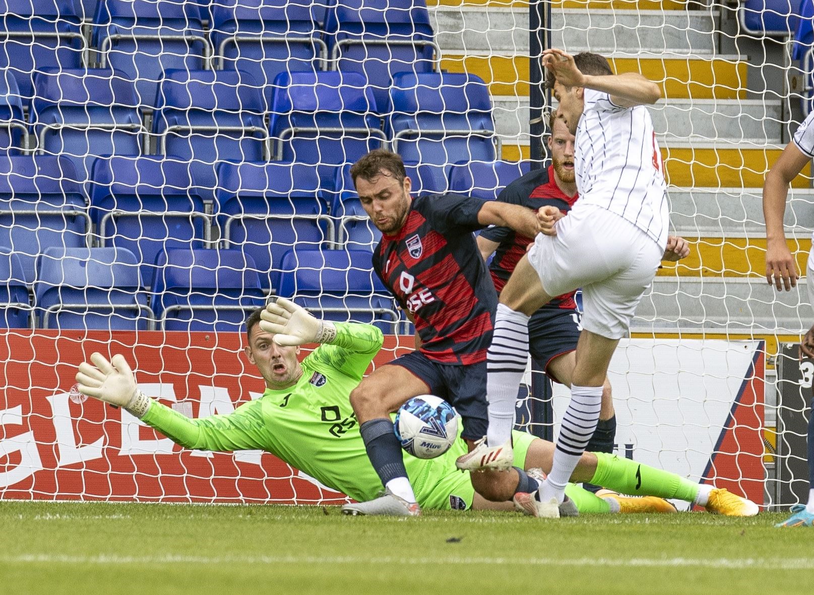 Ross County's Connor Randall blocks a shot from Dunfermline's Nikolay Todorov in this season's League Cup group clash.