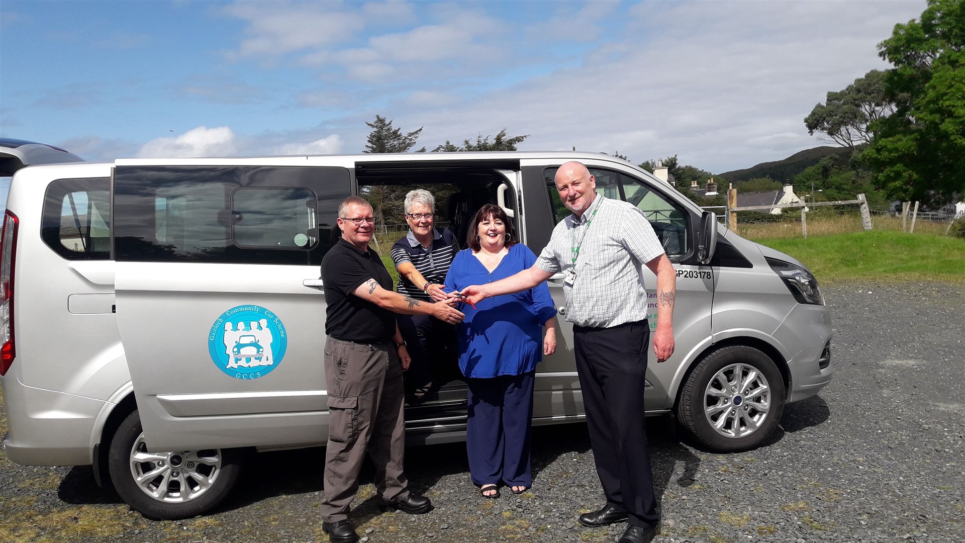 The Council’s Senior Transport Officer Ali MacDonald is pictured handing over the keys to (L to R) Driver Tony Raine; GCCS Director Annette Mackenzie and GCCS Co-ordinator Christine MacIver.