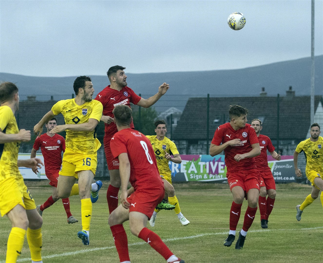 Picture - Ken Macpherson, Inverness. Scottish Premier Sports Cup. Brora Rangers(0) v Ross County(1). 21.07.21. Ross County's Alex Iacovitti rises above Brora’s Jordan Macrae to head in the only goal of the game past Brora 'keeper Joe Malin.