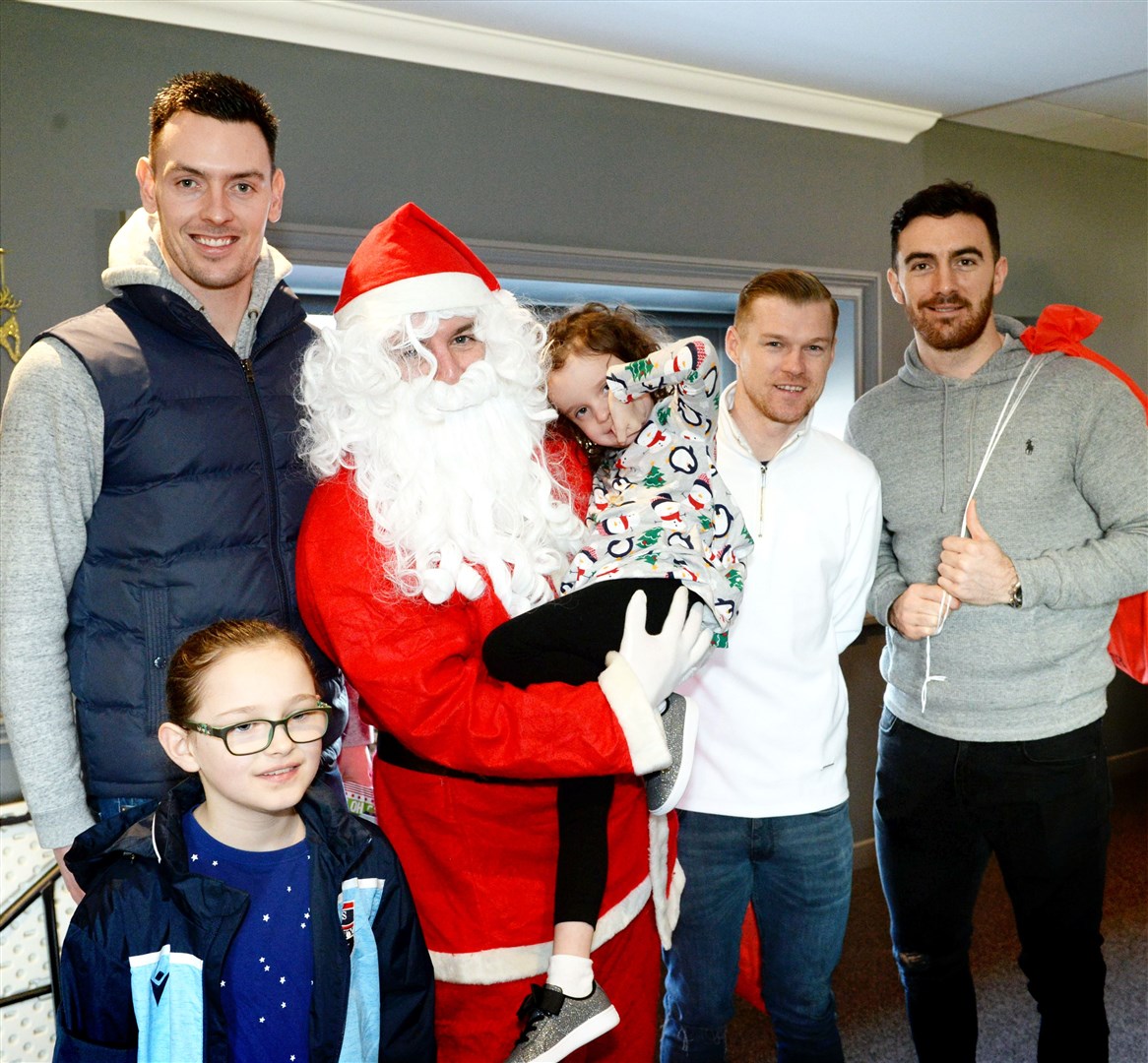 Ross County Brunch with Santa 2019..Ross Laidlaw, Santa, Billy McKay and Ross Draper get a photo with two of the children..Picture: James MacKenzie..