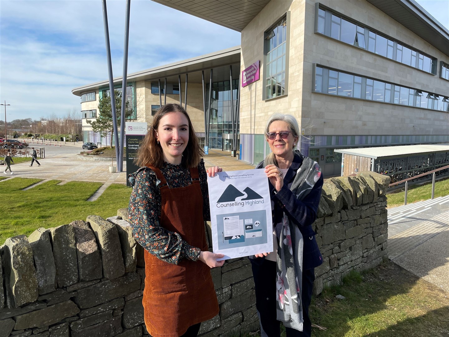 Inverness College UHI HND visual communication student Emily Clark and Counselling Highland chairwoman Anita Parker with some of Emily's winning designs.