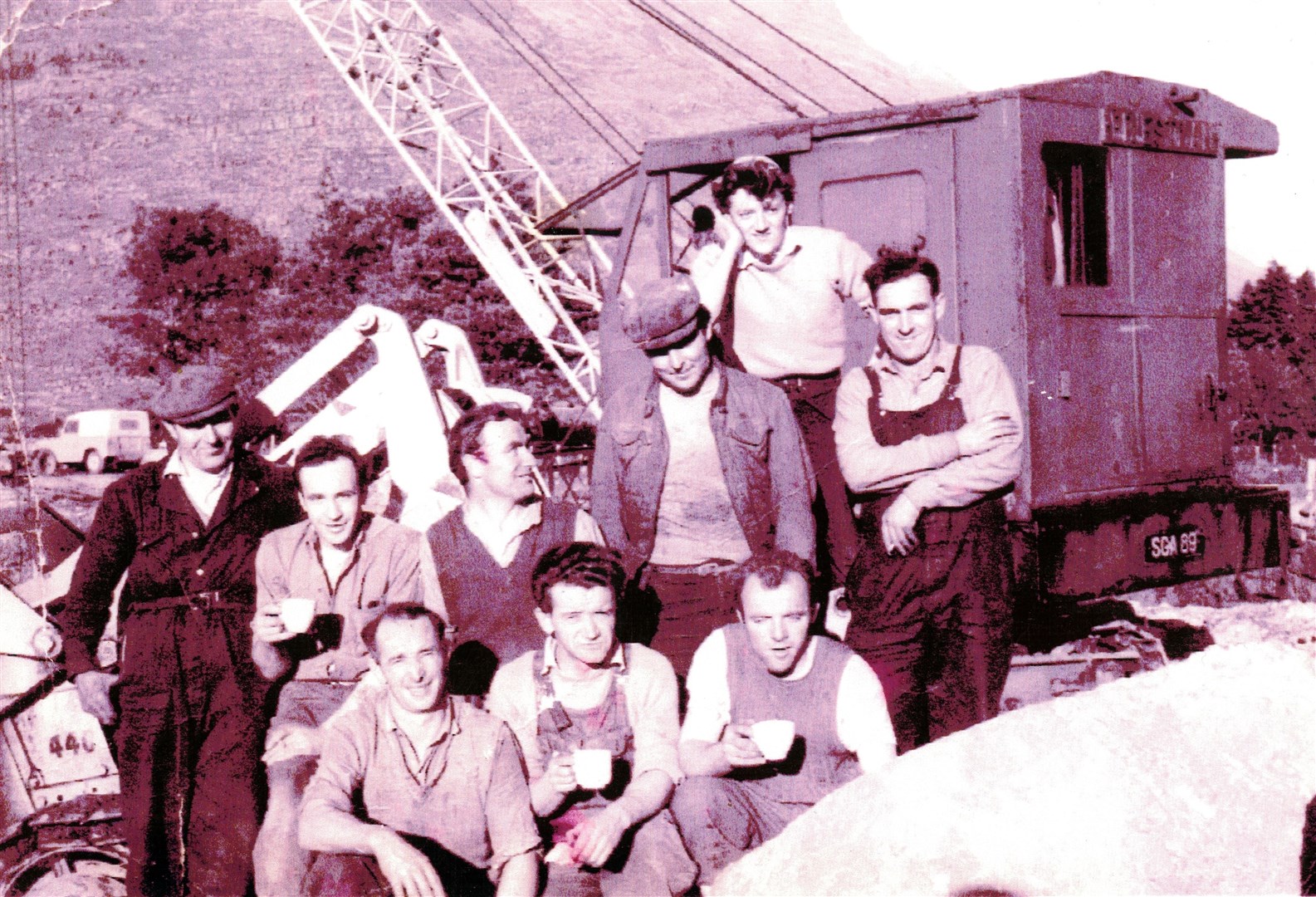 The Limmer Trinidad squad working on the Balgy Gap early in the 1960s. Until the Balgy Gap was breached in 1963, there was a lengthy diversion to get from Shieldaig to Torridon. Mrs J. MacDonald of Dingwall shared this photograph for which she has most of the names: Ian MacLennan, Dan Crombie, Cameron Shepherd, Bert Shepherd and Robin and Willie Newton (twins). Another worker was nicknamed Cash and another she has down as Tommy.