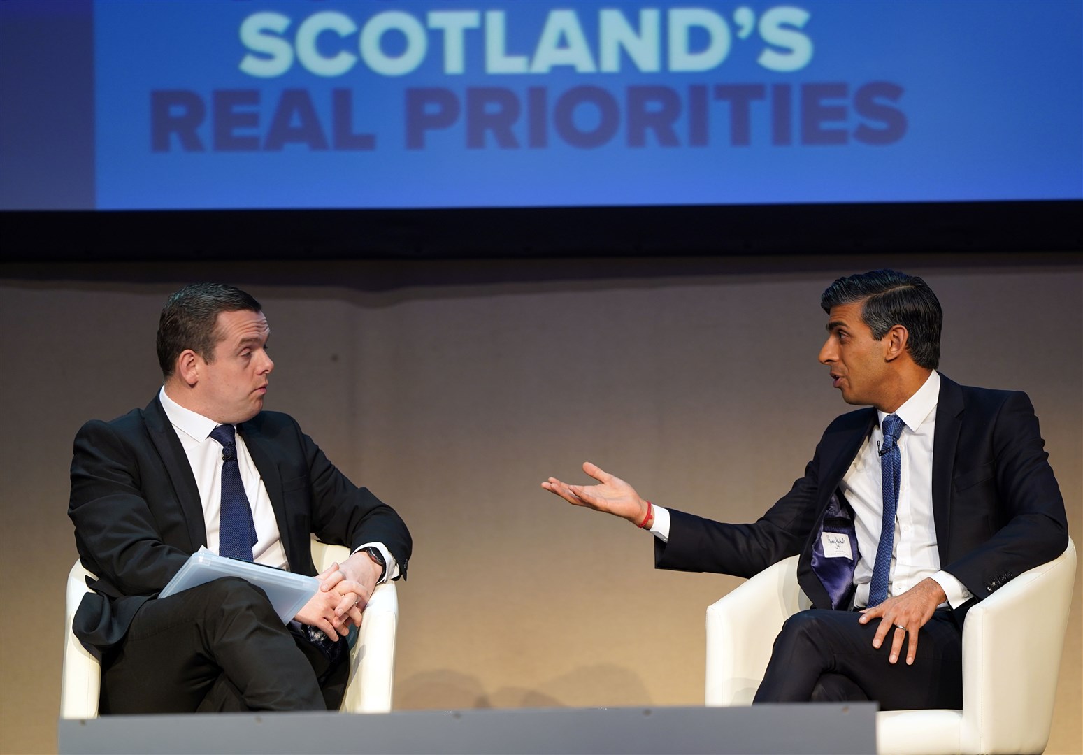 Douglas Ross, left, is said to have had a robust discussion about the proposal with Rishi Sunak, right, and Jeremy Hunt (PA)