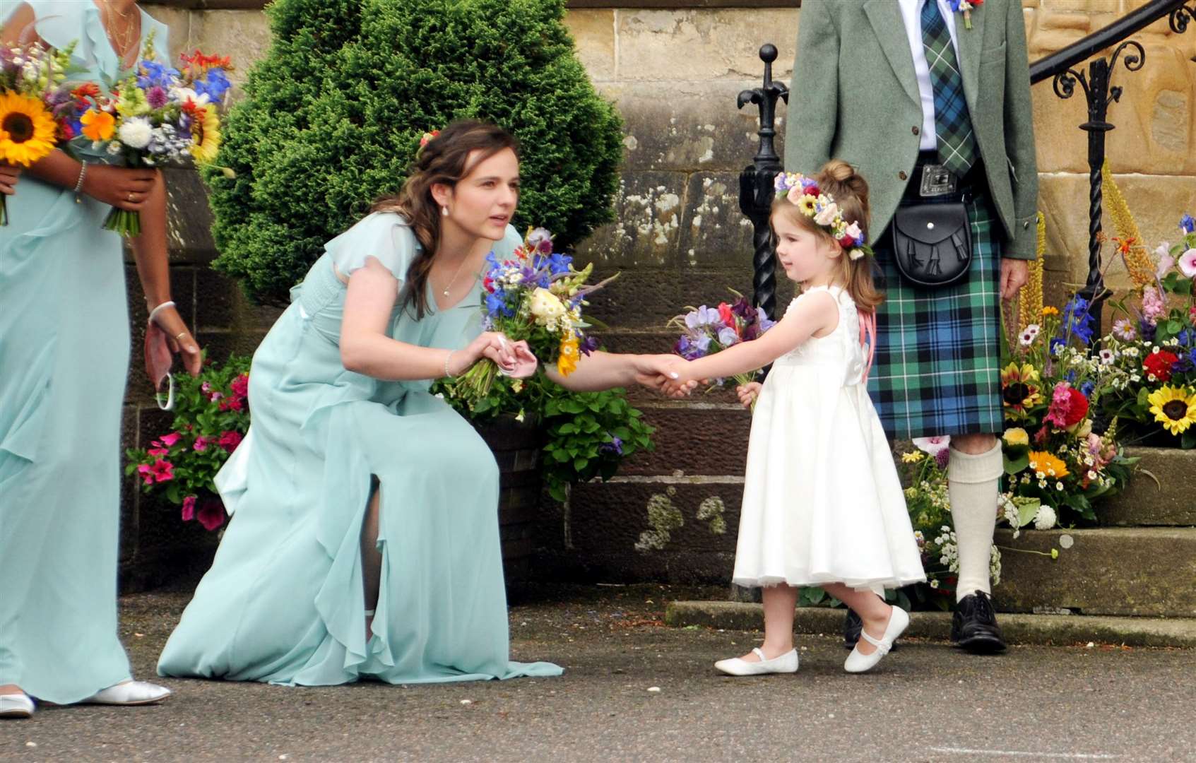 Kate Forbes's sister looking after the flower girl. Picture: James Mackenzie