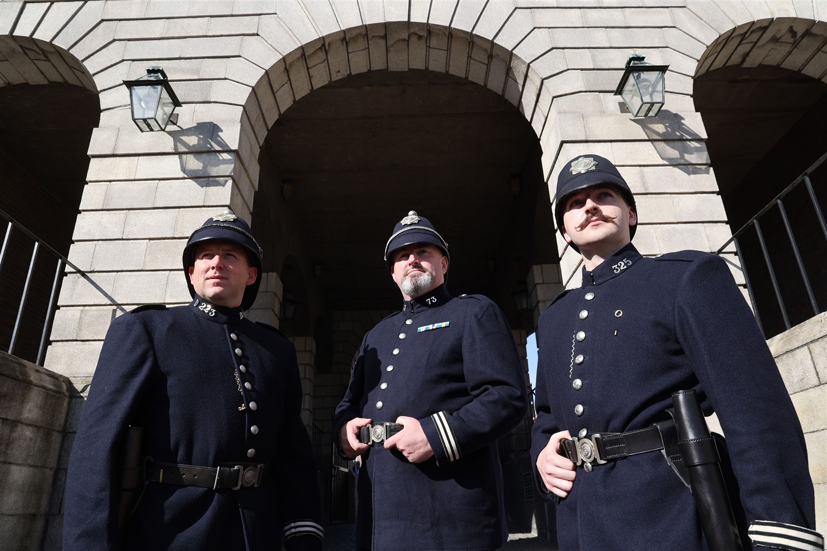 Garda members in the original uniform (from left) Matthew Gargan, Tom Daly and Emmet Harte (Nick Bradshaw/PA)