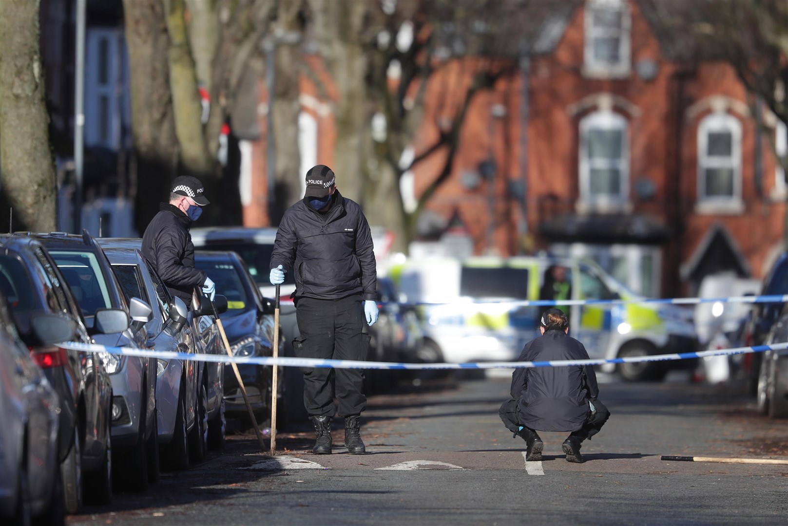 Police officers searching the scene in Linwood Road, Handsworth (David Davies/PA)