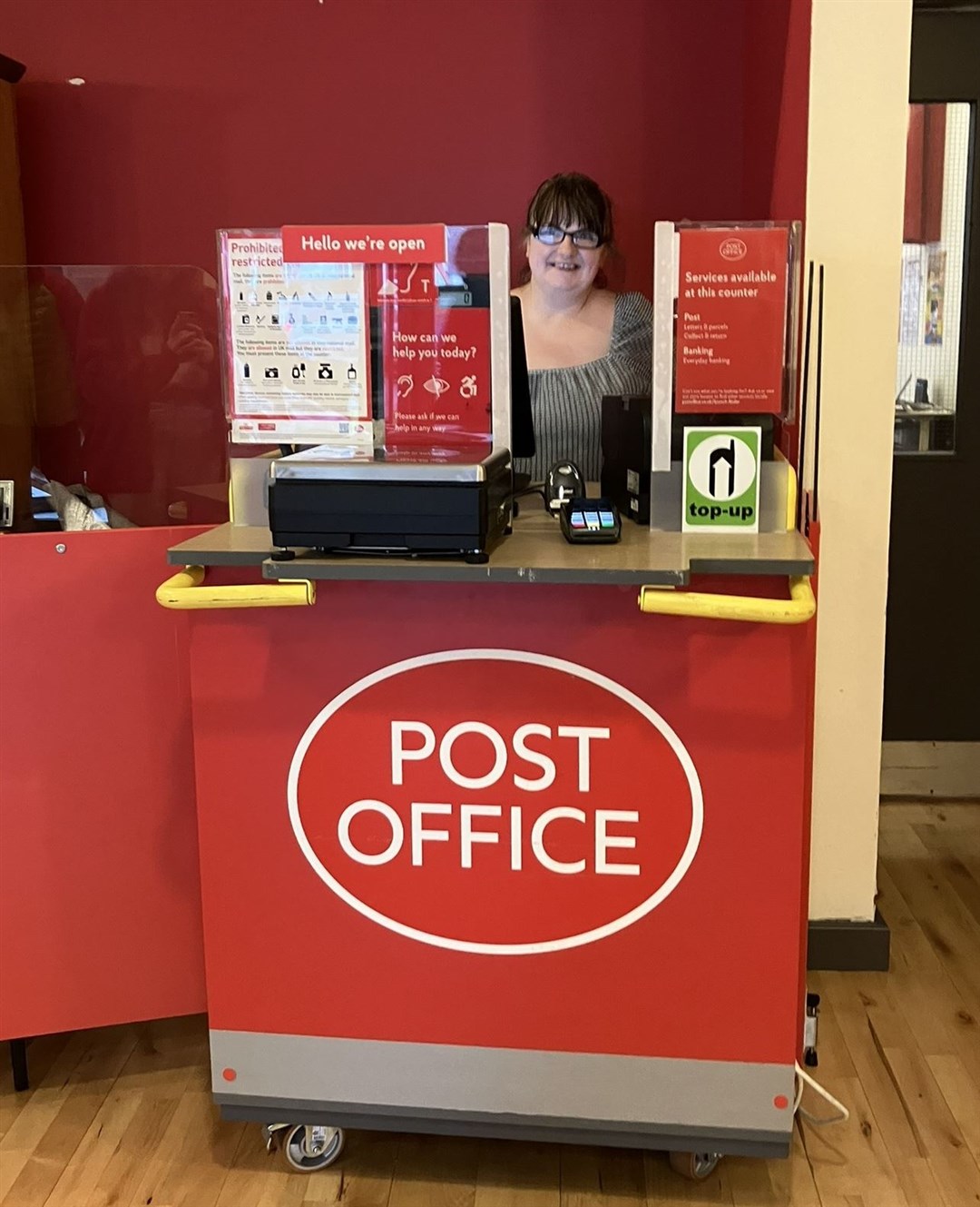 Heather Parlett at the temporary Post Office, in Ullapool Village Hall.