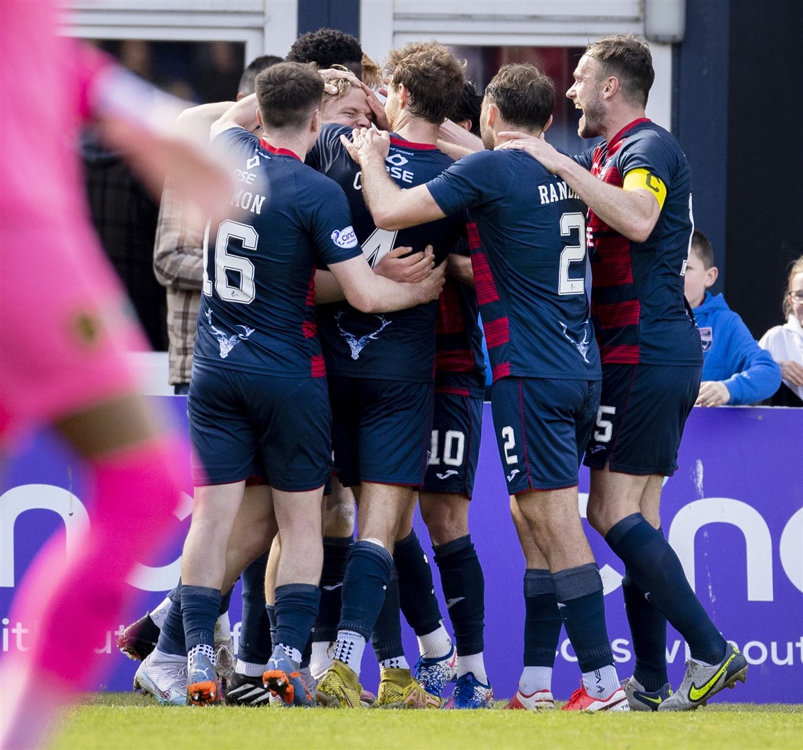 Alex Samuel was mobbed by teammates after finally opening his account for Ross County. Picture: Ken Macpherson