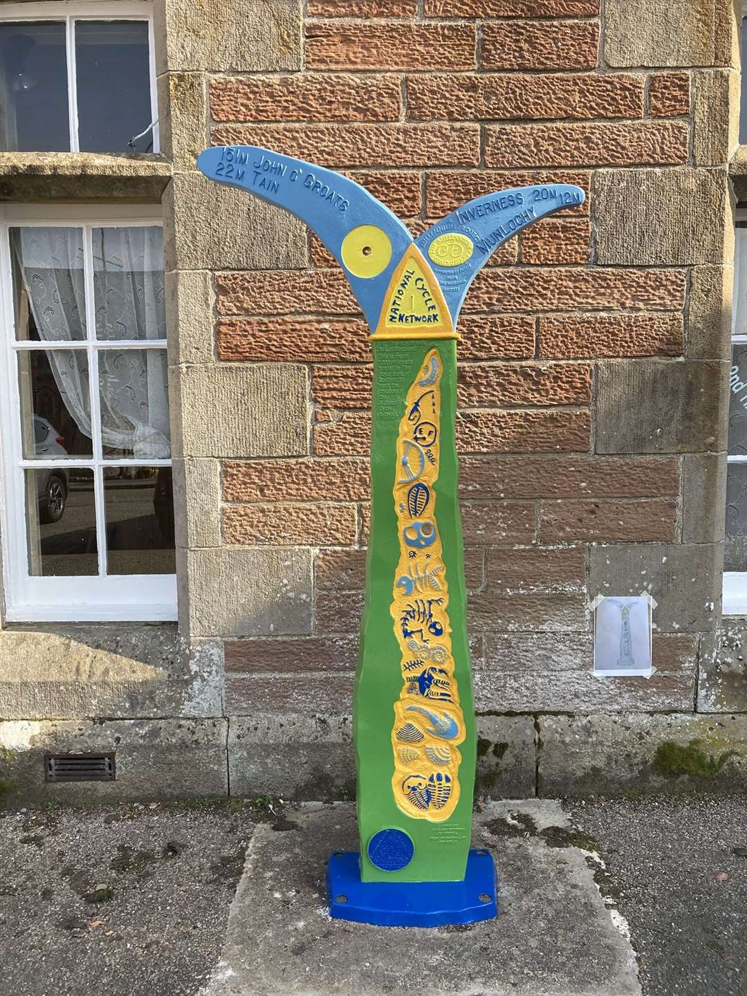 Milepost at Dingwall railway station – after Laura White painted the Ross-shire landmark.