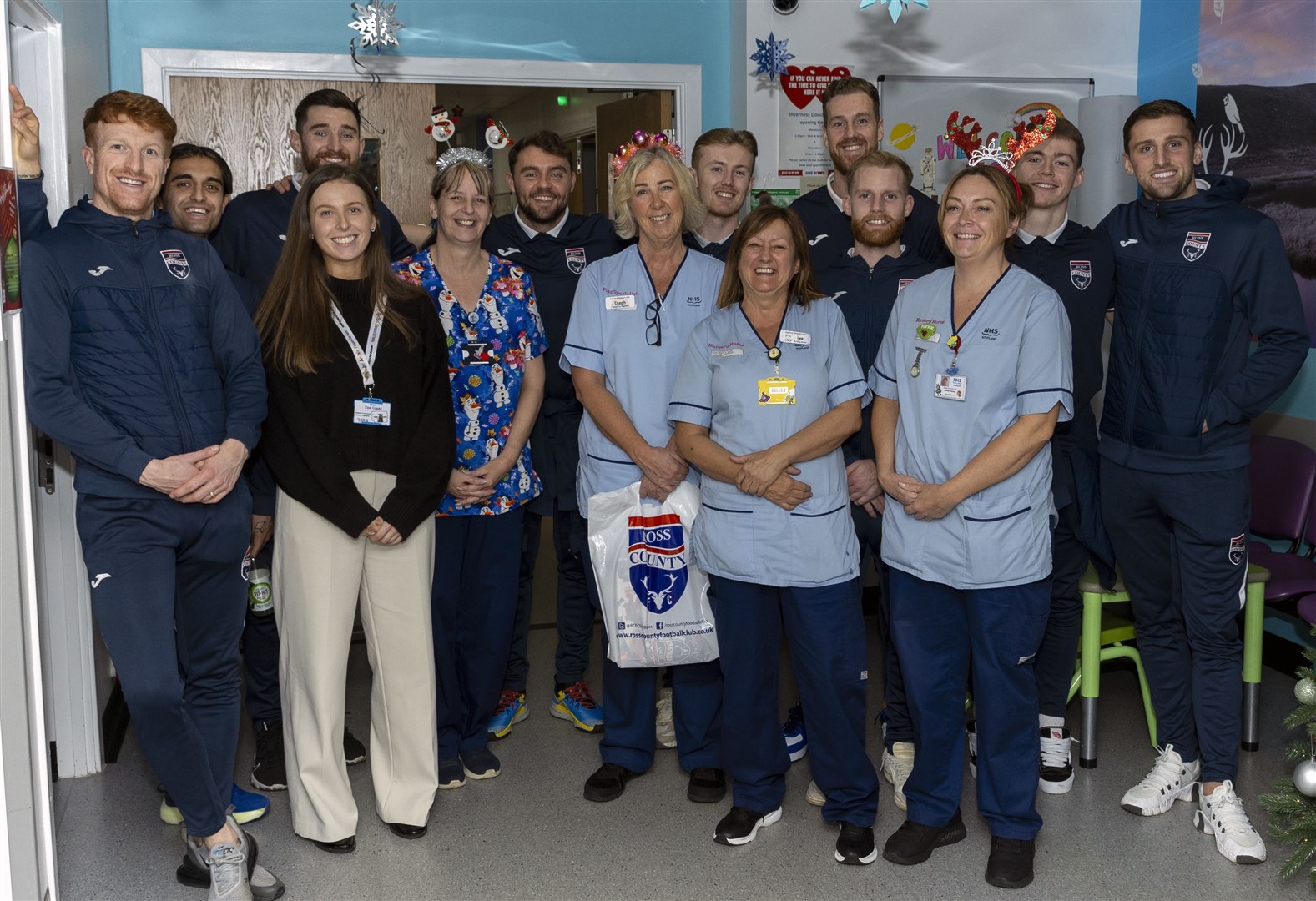 (from left to right) Simon Murray, Yan Dhanda, Jack Baldwin, Connor Randall, Kyle Turner, Jordan White, Josh Sims, Jay Henderson and Ben Purrington pictured with staff in the Highland Children’s Unit. Picture: Ken Macpherson