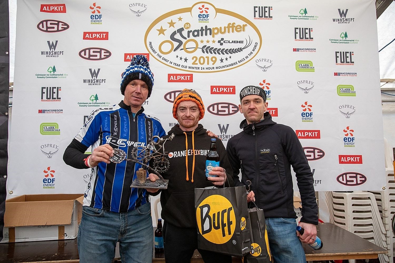 Maryburgh athlete Marty Ross (centre) with Keith Forsyth and Chris Pitblado after winning Strathpuffer 24 last year. Picture: Gary Williamson Photography
