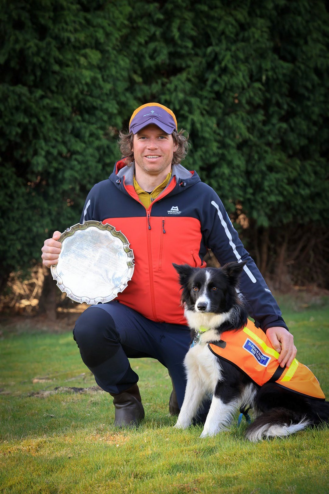 Dave Mitchell of the Dundonnell Mountain Rescue team with Skye - and the trophy they won. Picture: Dundonnell Mountain Rescue Team