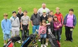 Kenny Hearton, junior convenor at Invergordon Golf Club, with juniors taking part in the club’s Monday Junior sessions laid on for the school summer holidays.