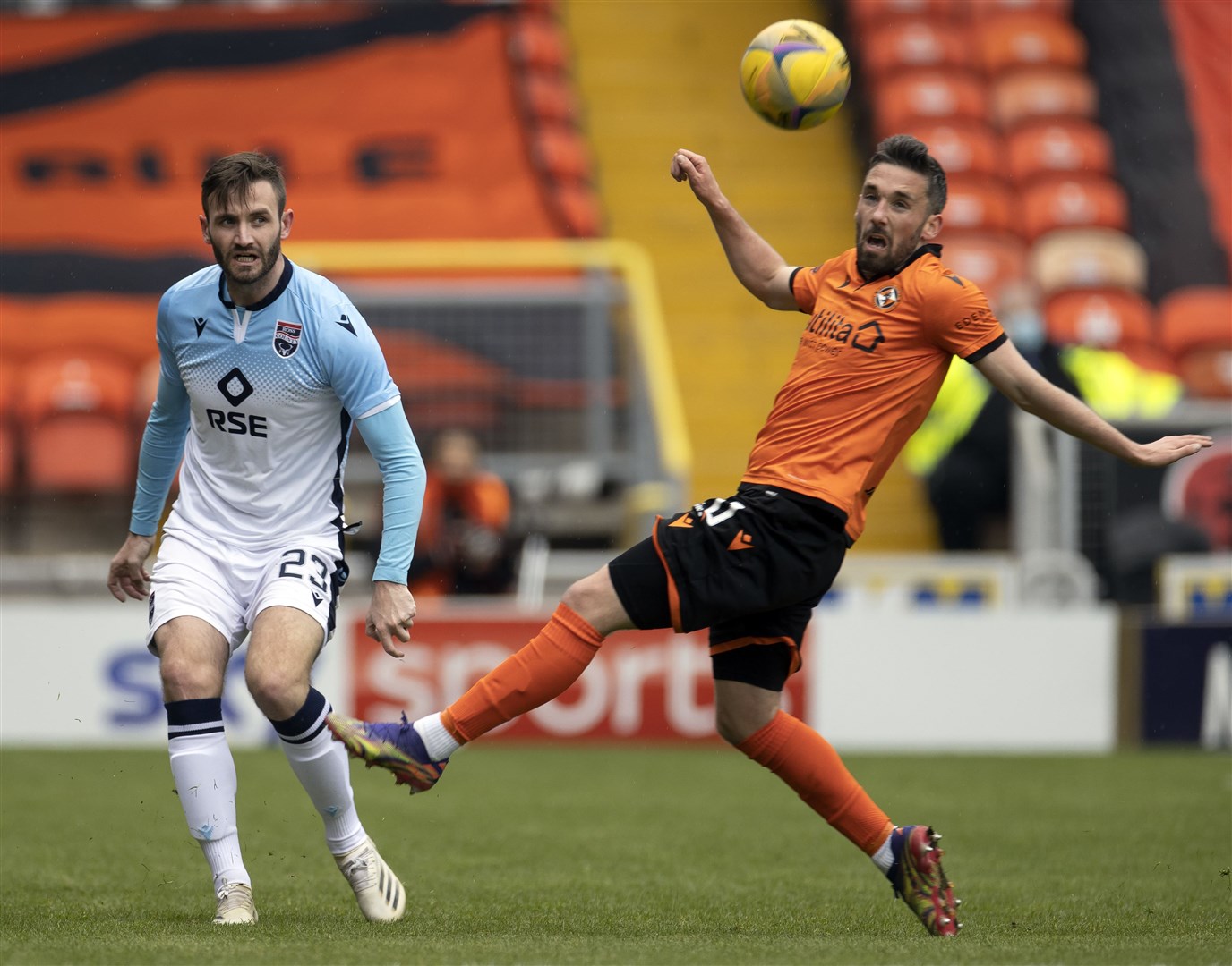Picture - Ken Macpherson, Inverness. Dundee Utd(0) v Ross County(2). 01.05.21. Ross County's Jason Naismith clears from Dundee Utd's Nicky Clark.