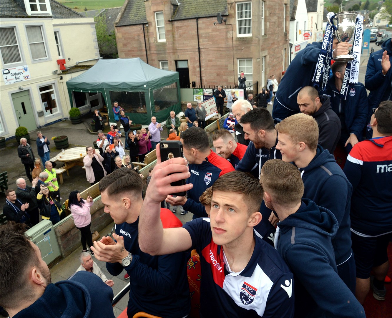 Ross Munro pictured on the open top bus parade when Ross County won the Championship in 2019. Picture: HNM