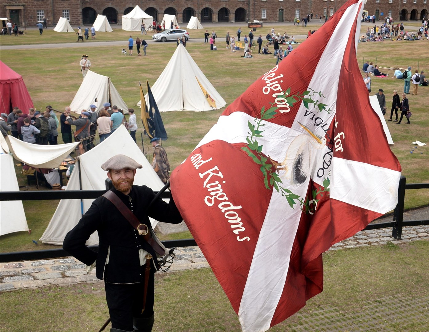 Martin Scott with the colours of the Covenanters at a Kings and Clansmen event at Fort George.