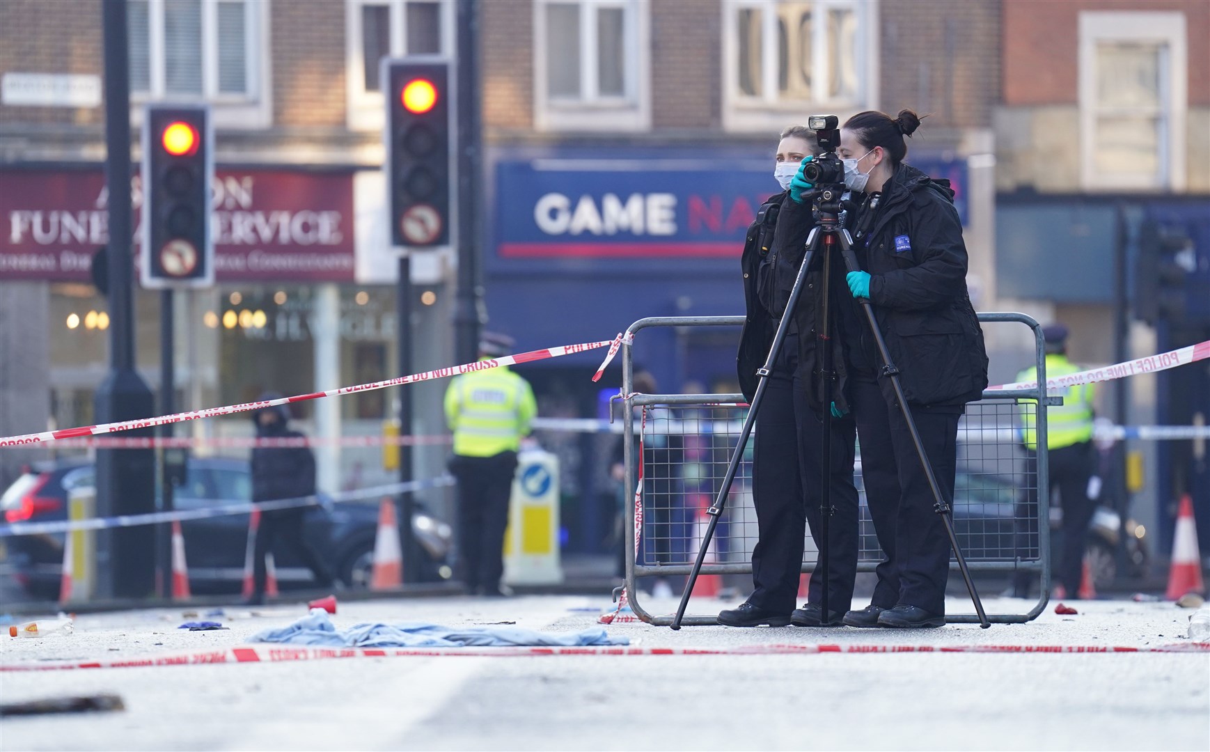 Police officers outside Brixton O2 Academy after a crush caused by ticketless fans trying to get inside (PA)