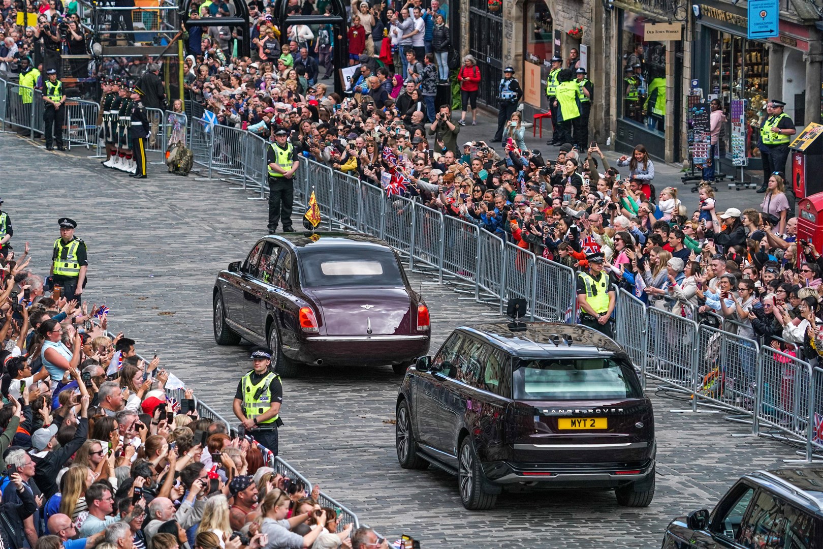Crowds lined the streets to see the King and Queen pass by (Peter Summers/PA)