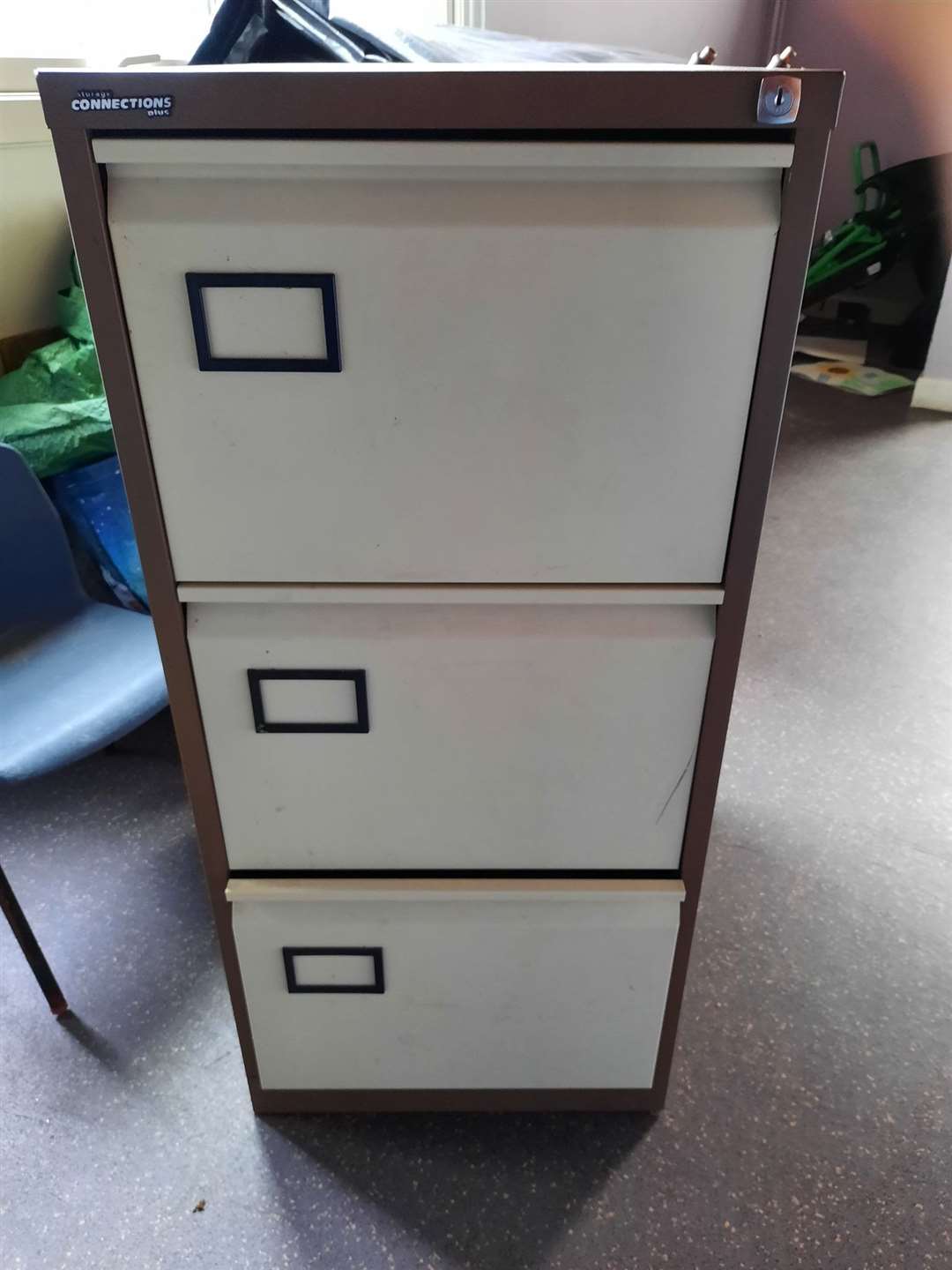 A filing cabinet is amongst the items no longer needed.