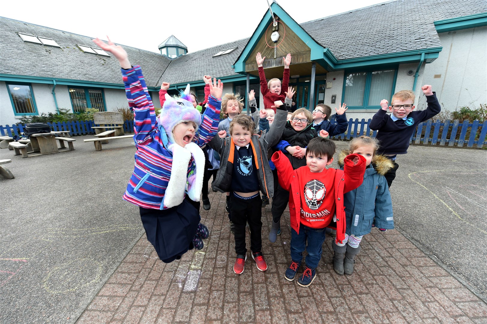 Jumping for joy: Strathpeffer Primary School children react to the news. Picture: Callum Mackay