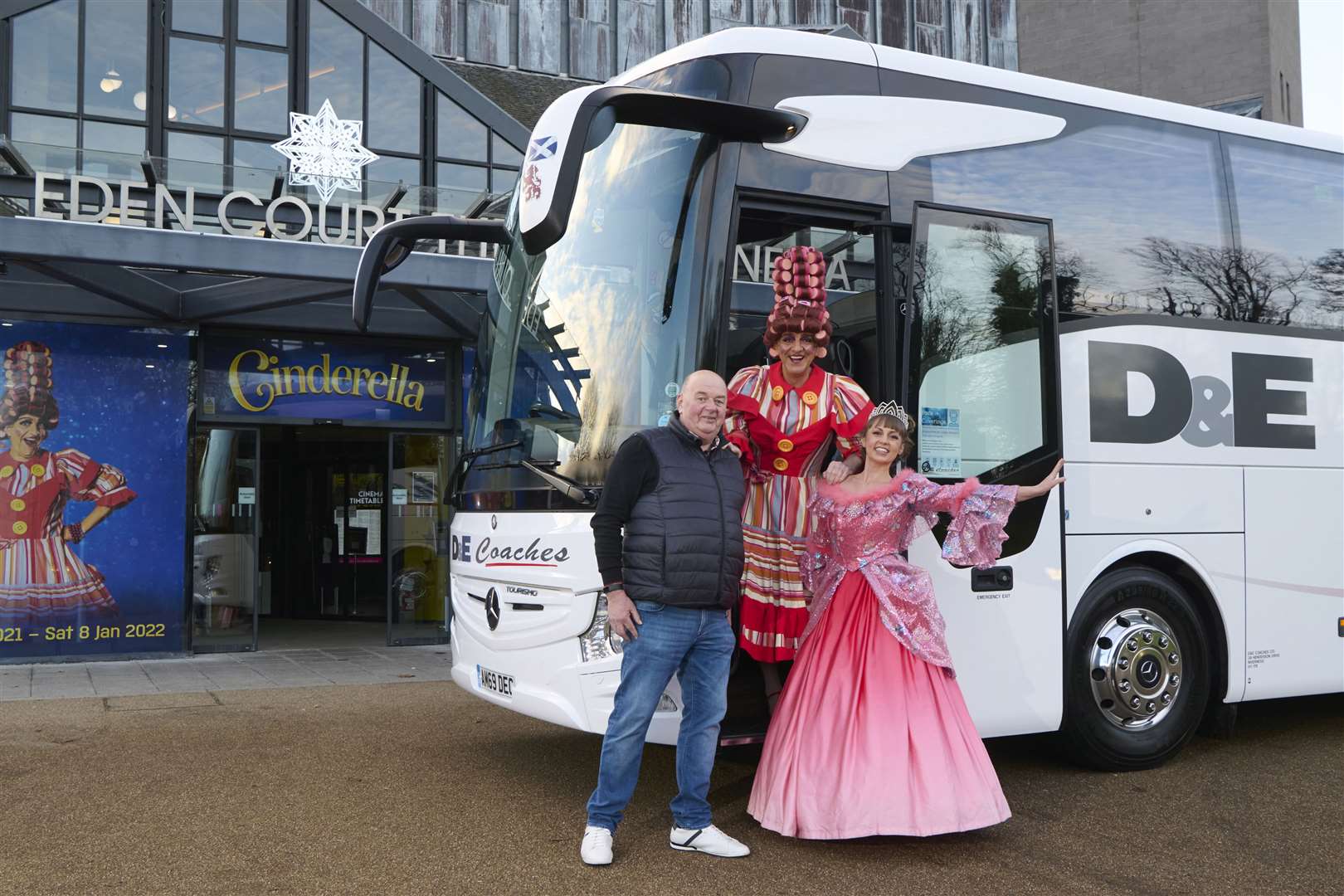 D&E Coaches boss Donald Mathieson with panto stars Steven Wren and Claire Darcy.