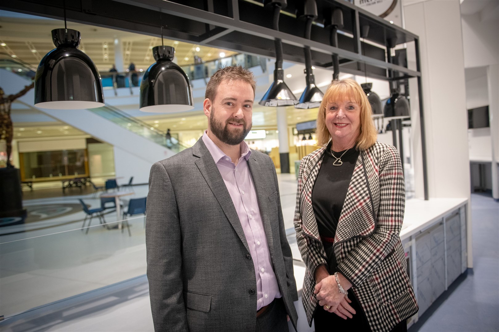 Chris Kershaw takes a look at the centre's new food court with outgoing manager Jackie Cuddy who retires later this month. Picture: Callum Mackay.