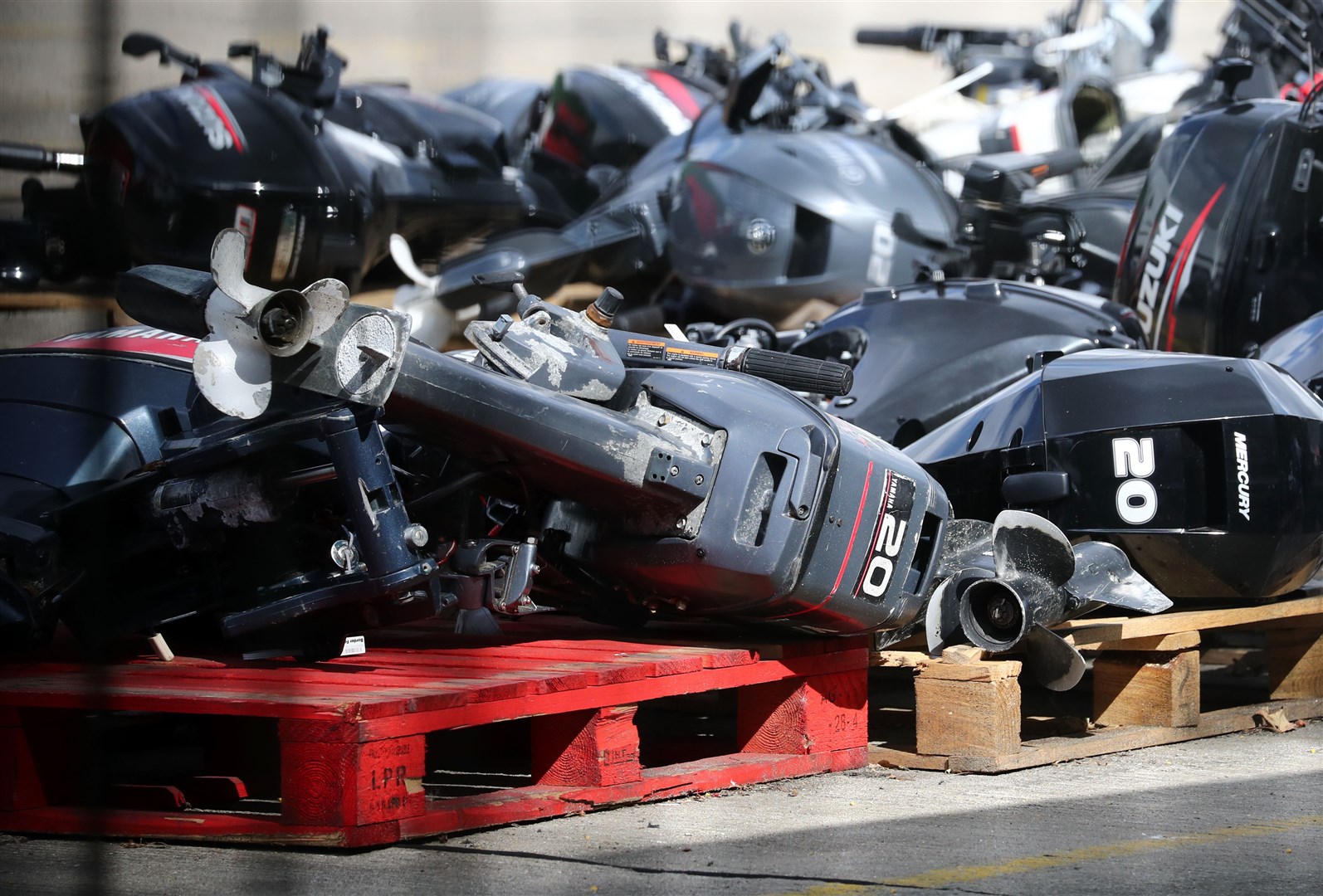 A view of outboard engines for small boats thought to be used in migrant crossings across the Channel at a storage facility in Dover, Kent (Gareth Fuller/PA)