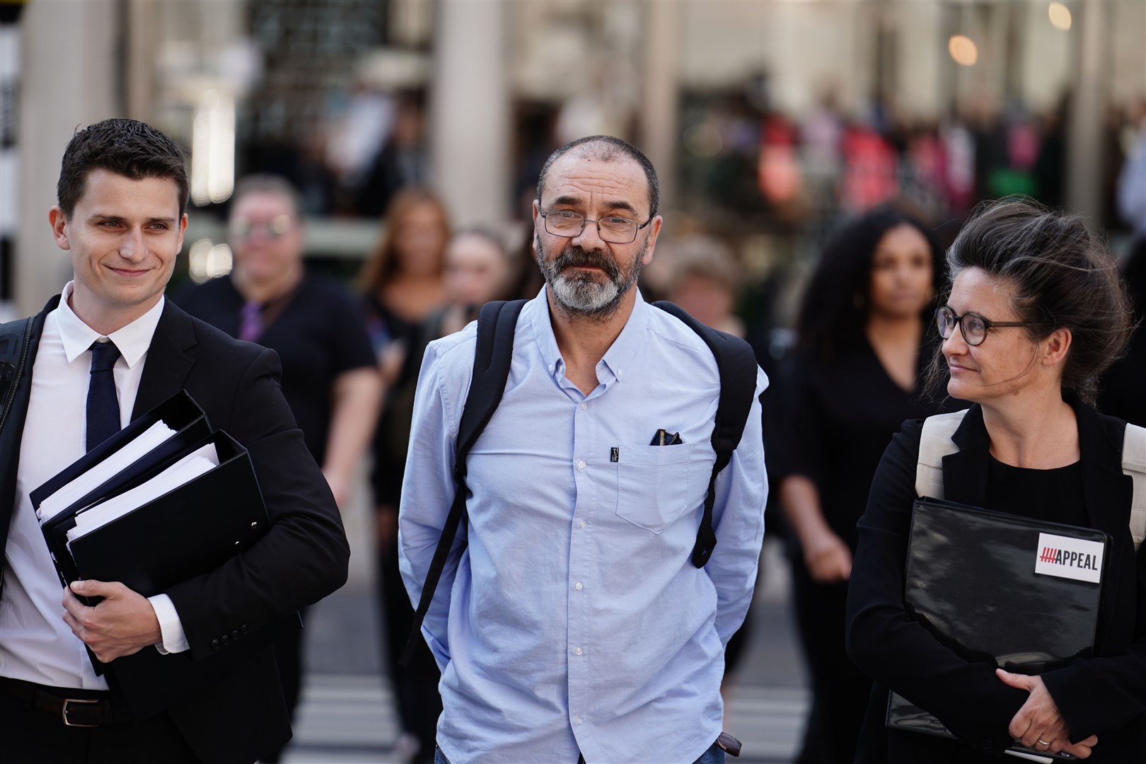 Andrew Malkinson, centre, arriving at the Royal Courts of Justice in London, ahead of his hearing at the Court of Appeal over his 2003 rape conviction (Jordan Pettitt/PA)