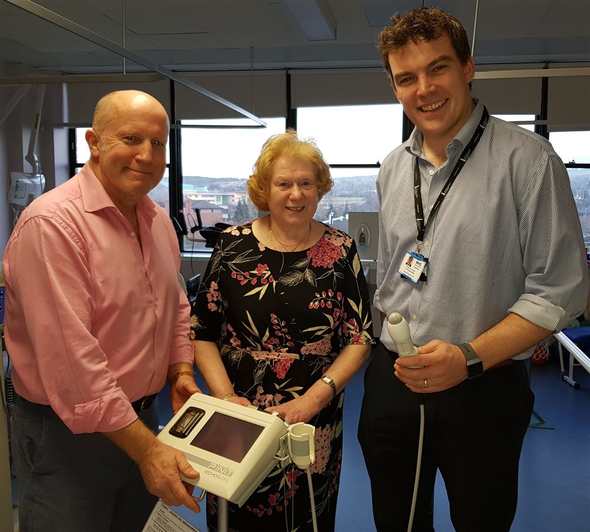Consultant orthopaedic surgeon Andrew Kent with chair of Friends of Raigmore Christina Cameron and Dr Thomas Harding, specialty registrar, with the scanner.